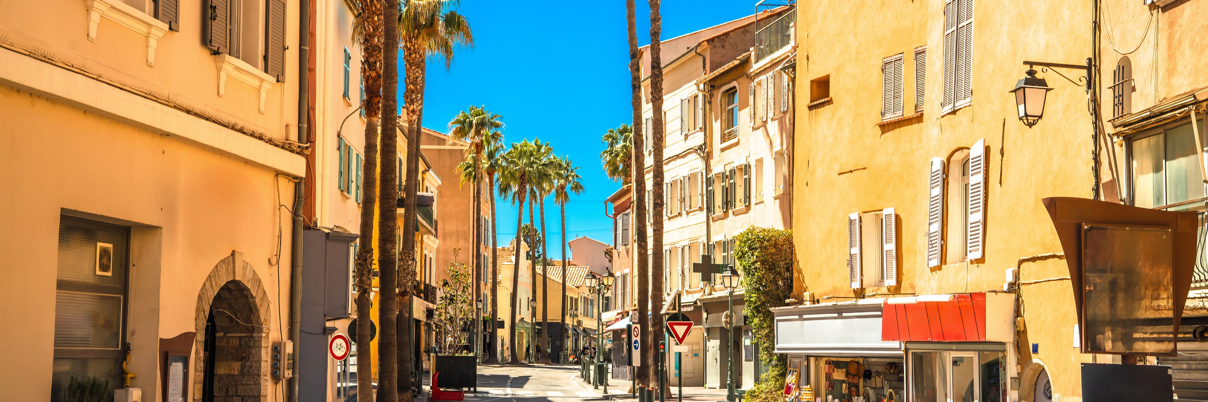 Empty street between buildings.