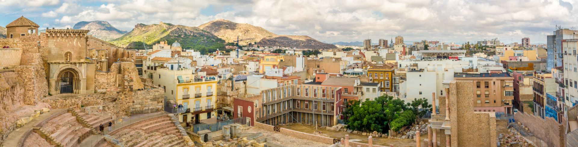 Buildings surround an open plaza in Cartagena, Spain.