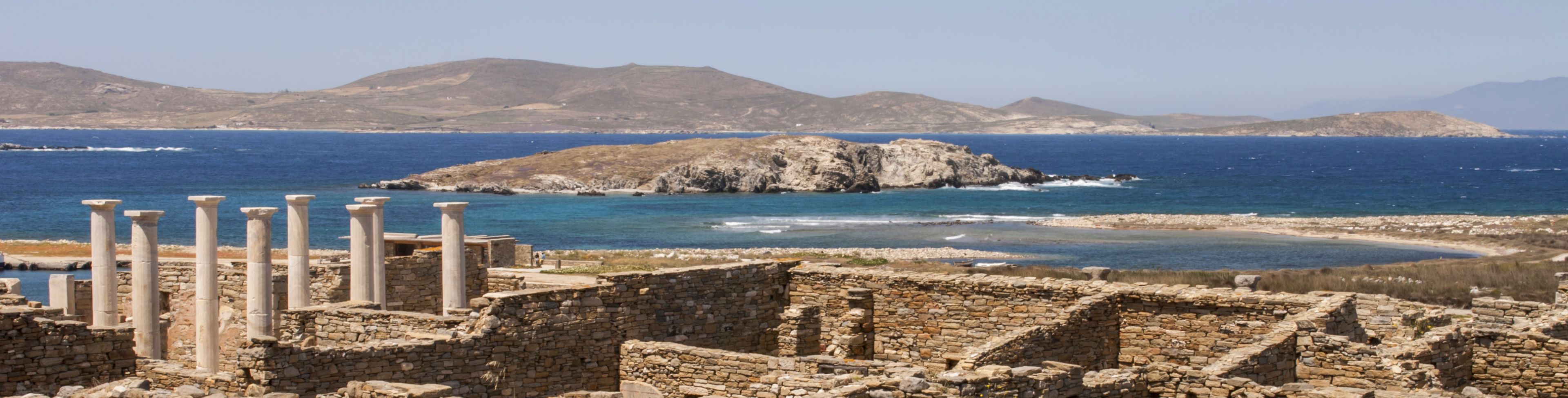 Greek ruins overlooking the water. 