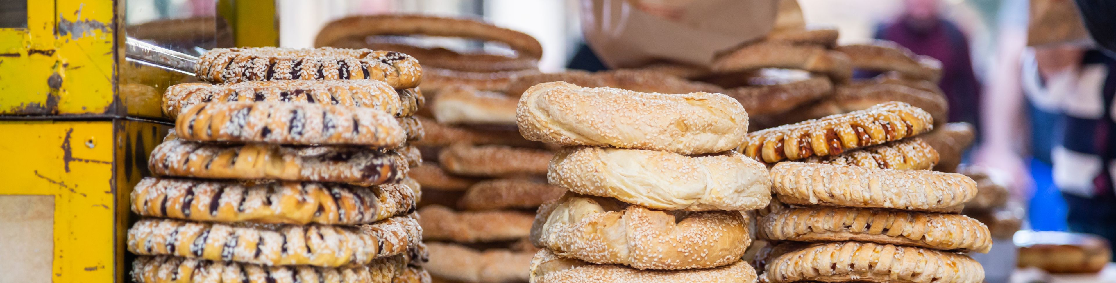 Stack of different breaded pastries.