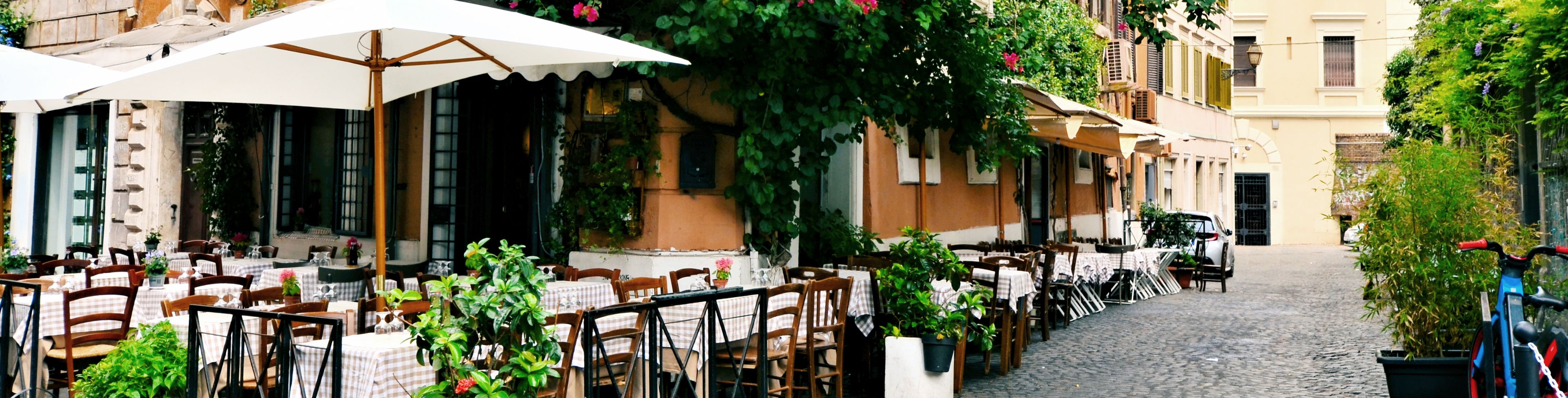 Empty restaurant at a corner of a building.