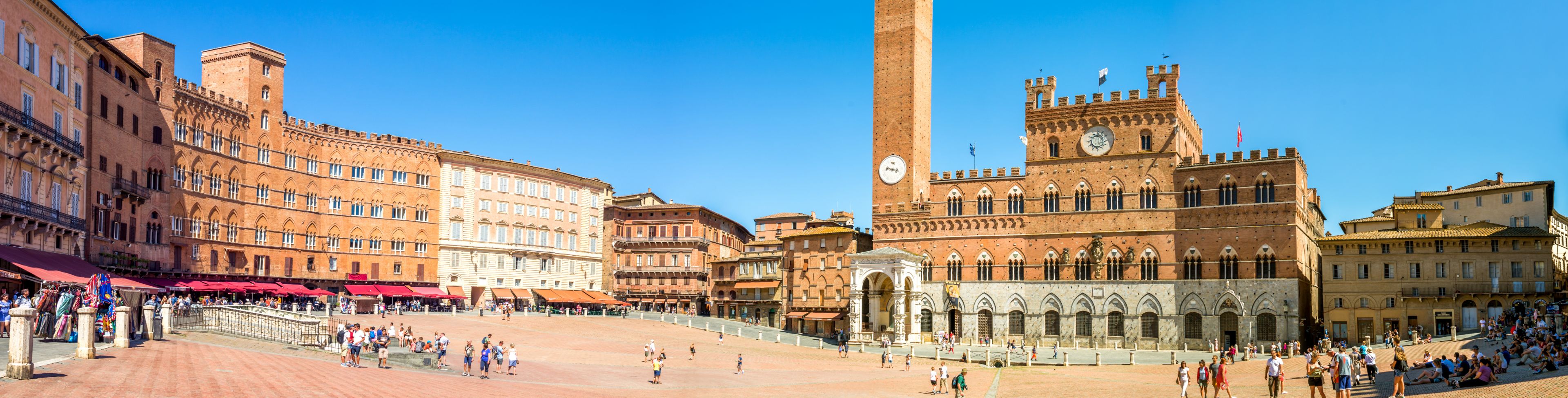 Town square surrounded by large buildings.
