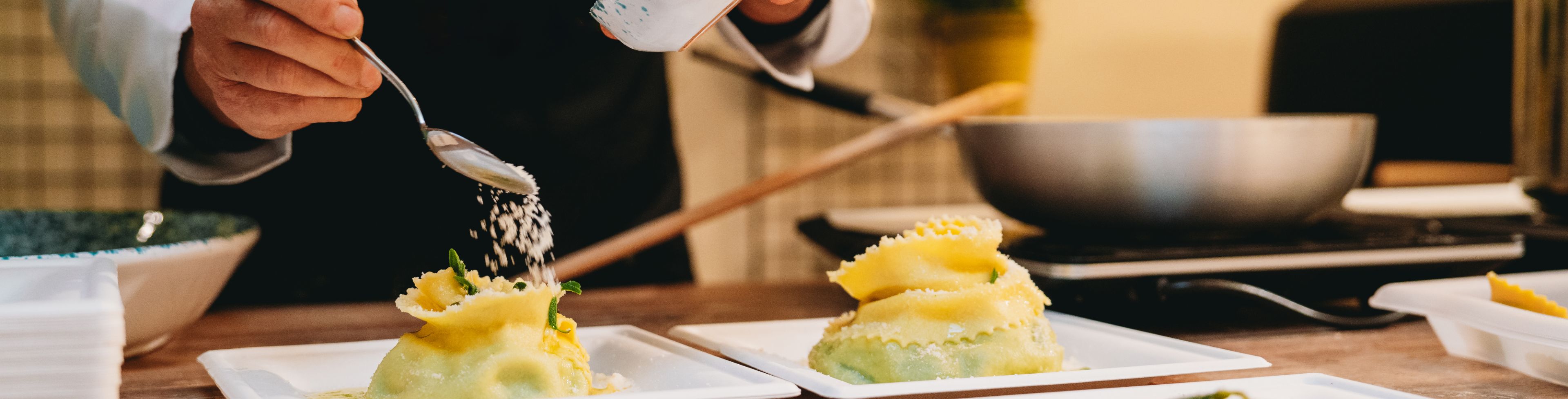 Someone making food in a professional kitchen.