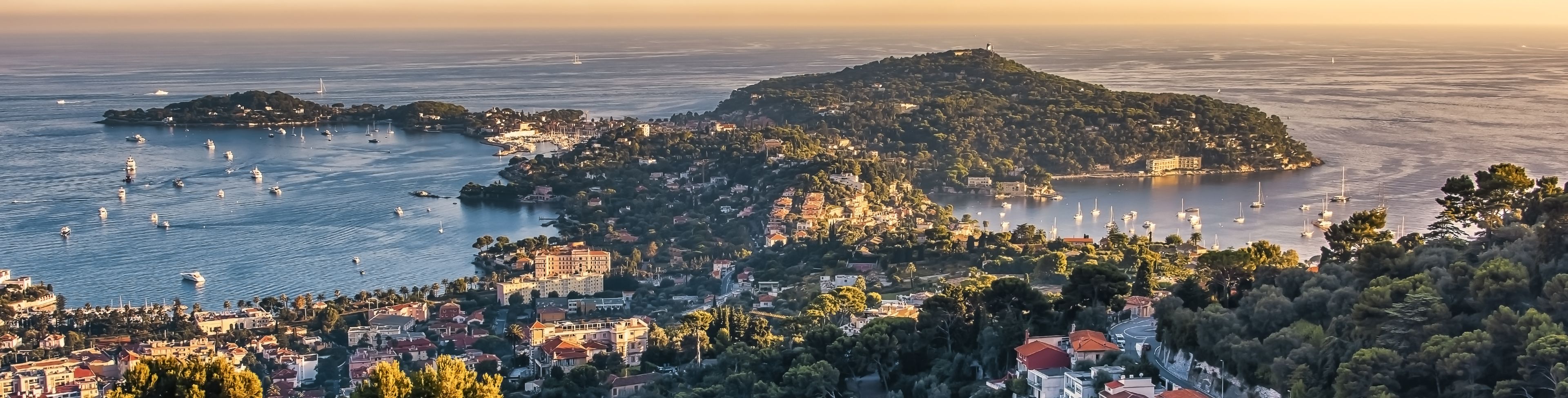 Aerial view of Monte Carlo and the ocean in the distance.