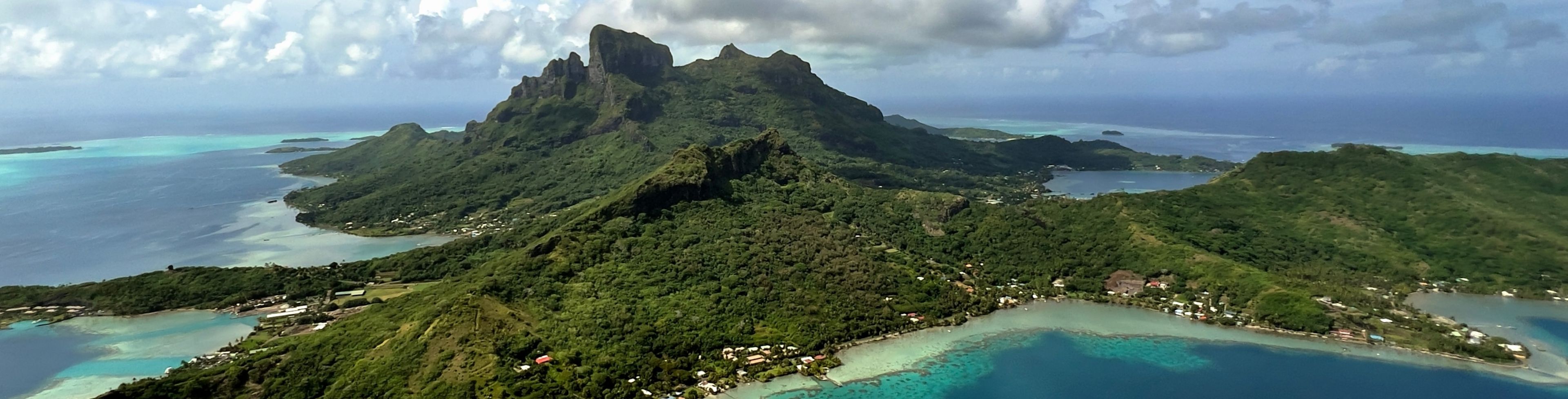 Sky view of island surrounded by the ocean.