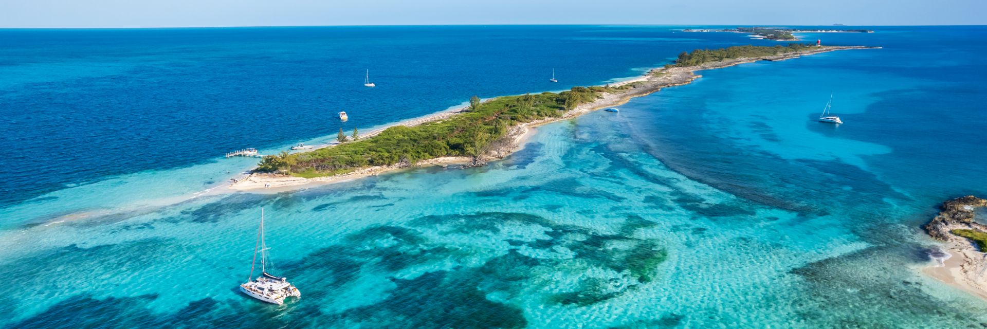 Aerial view of island surrounded by the sea.