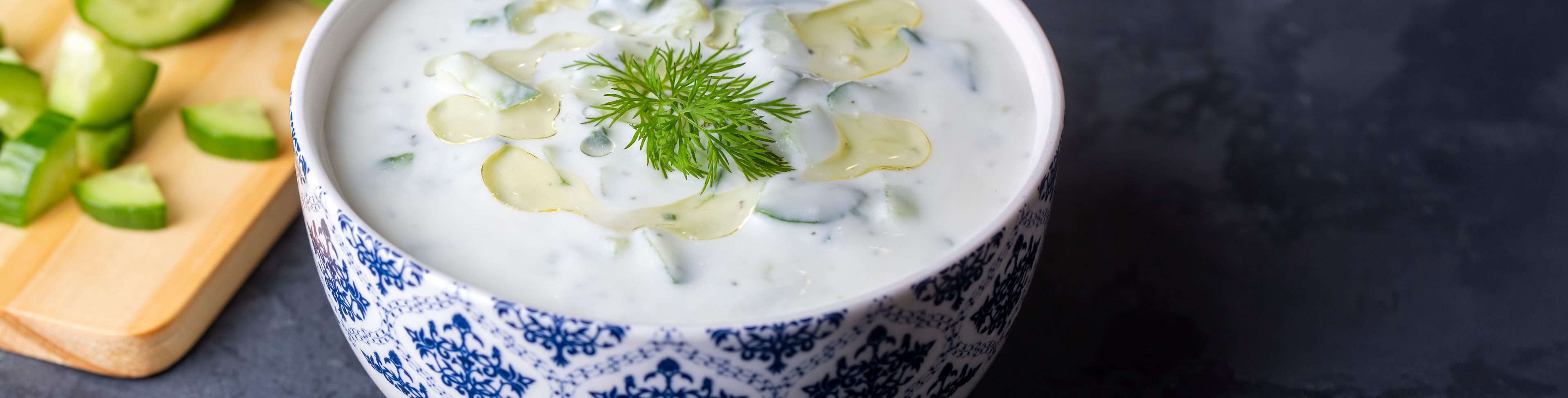 Bowl of white soup with a garnish on top.