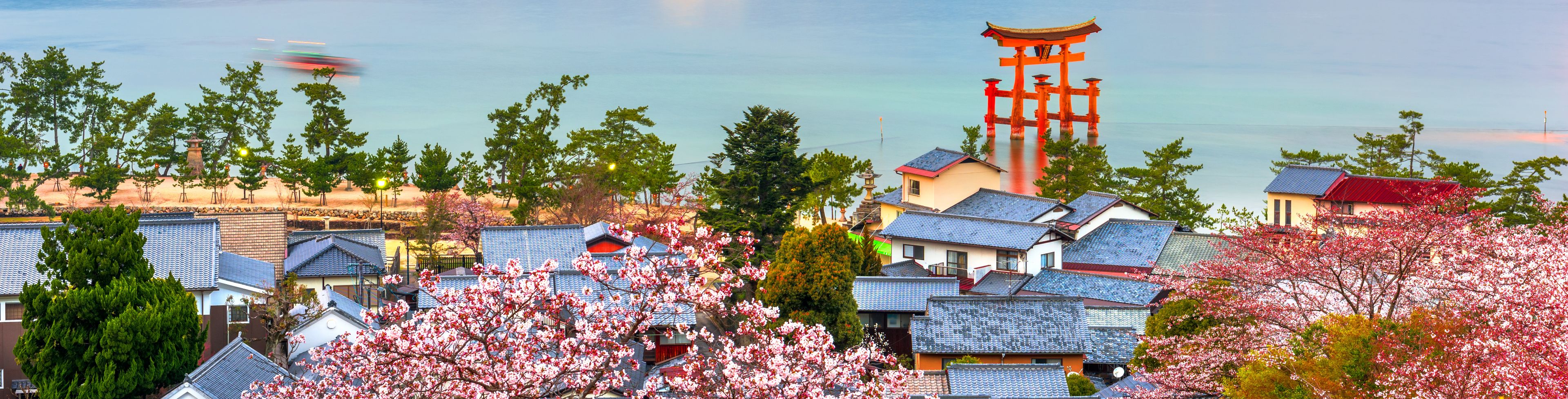 View of the city and shrine near the water.