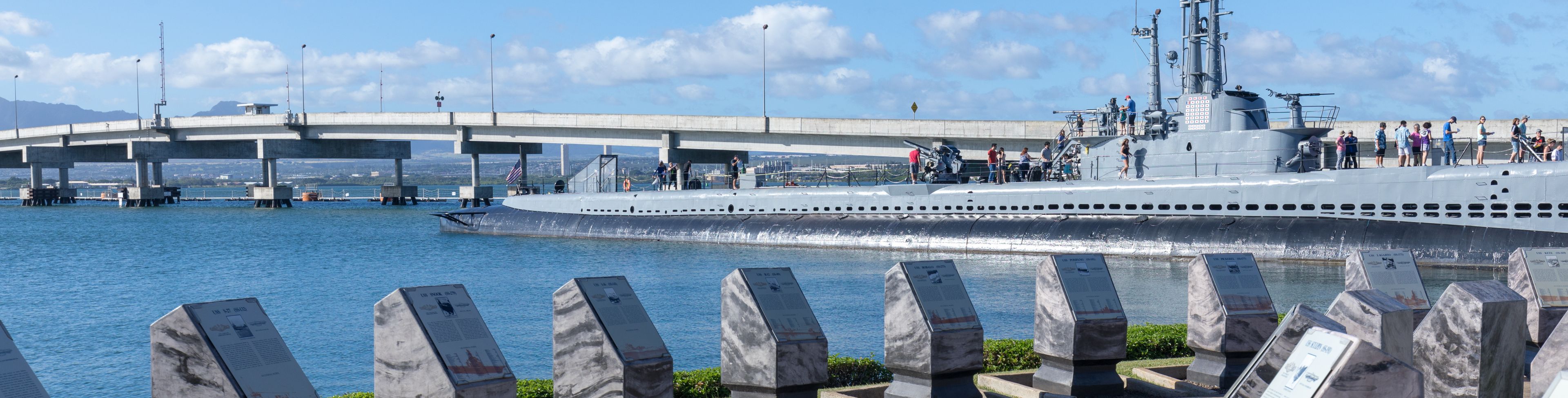 Pearl Harbor memorial stones along a path.