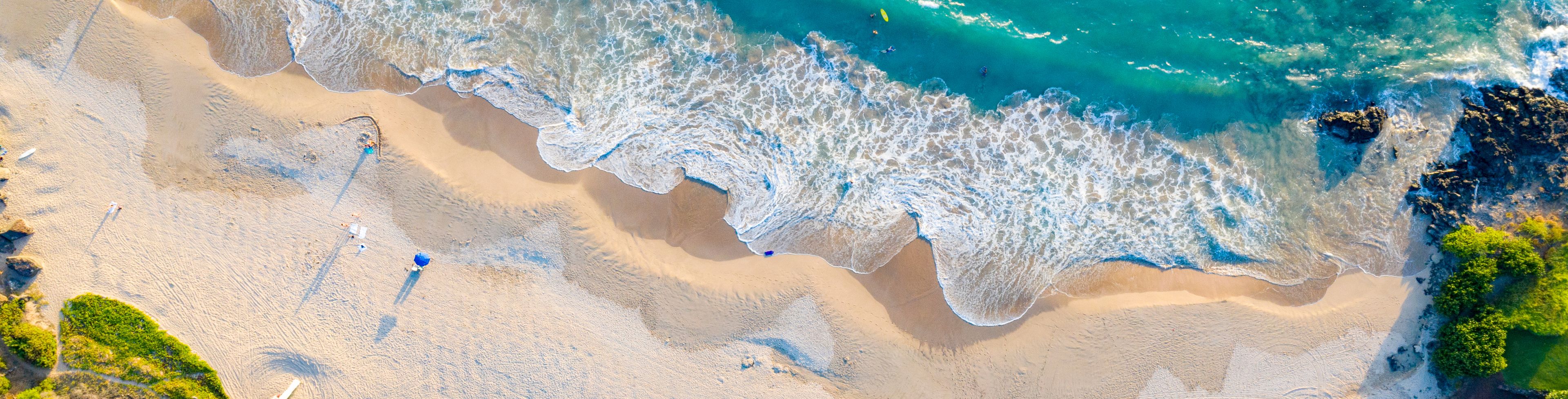 Aerial view of a white sandy beach.